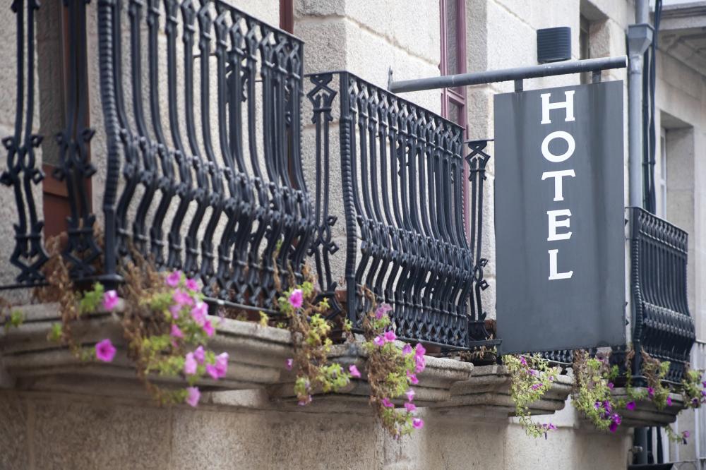 hotel sign next to balconies