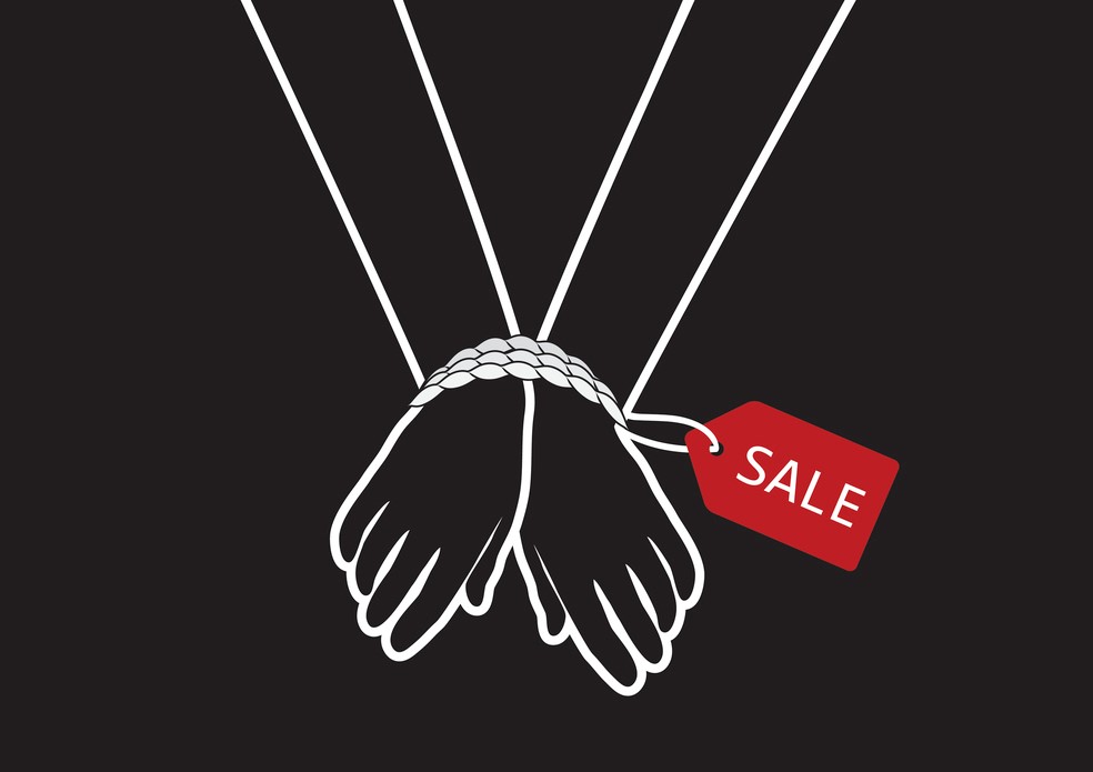 hands bound with rope and sale tag