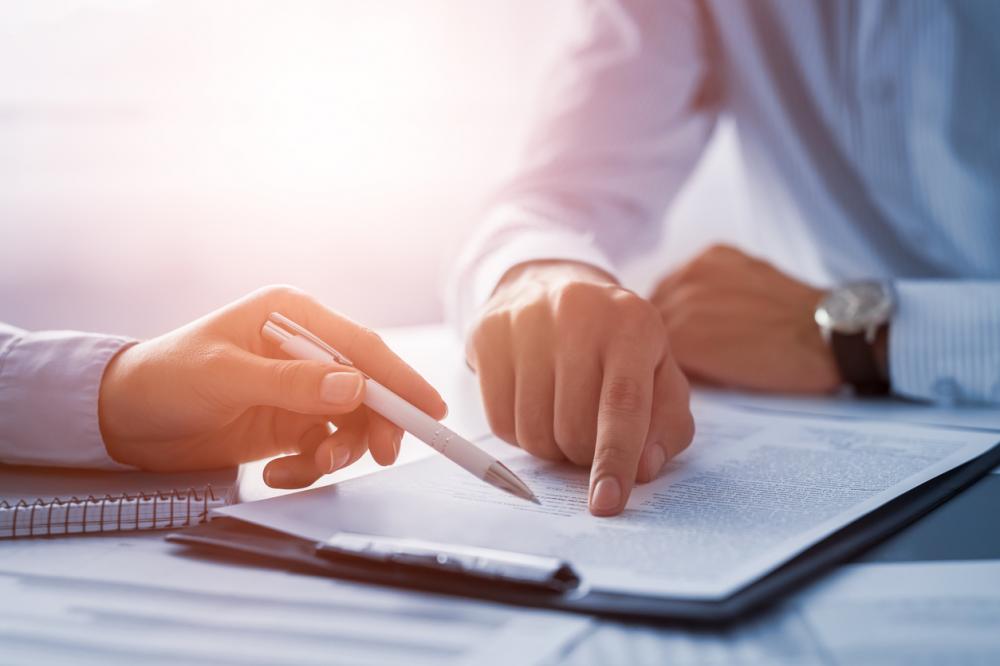 insurance agent going through paperwork with client