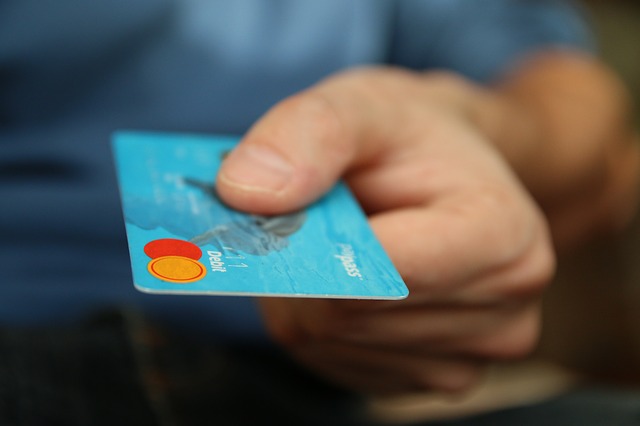 person handing over credit card