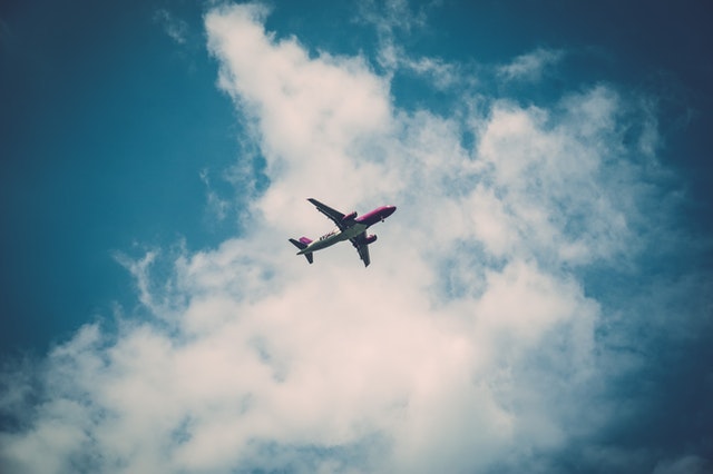 airplane flying through the sky