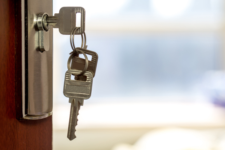 key hanging from door lock