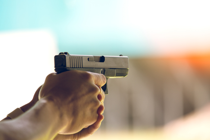 person holding a gun