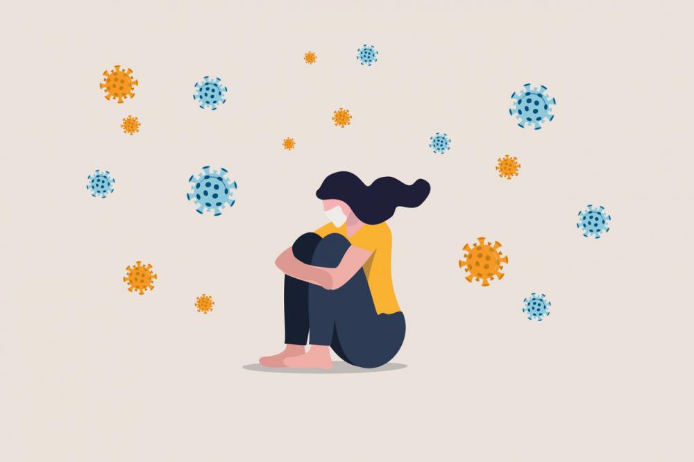 woman feeling isolated and depressed, surrounded by covid-19 bacteria