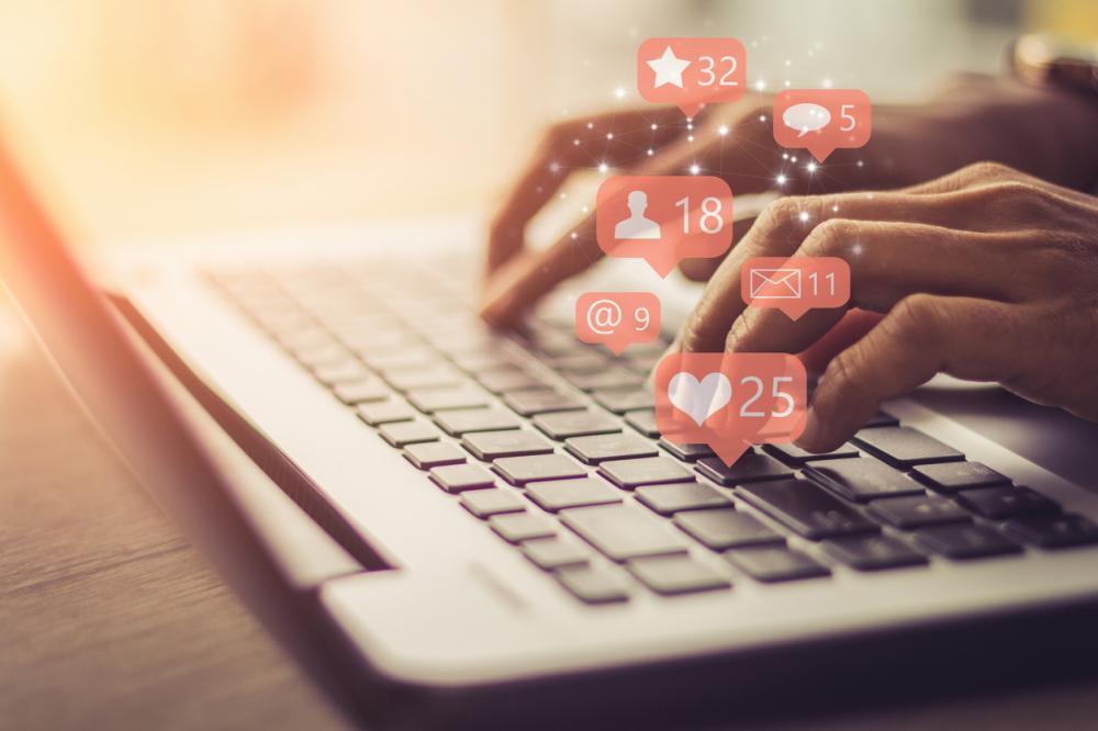 social media icons coming from laptop