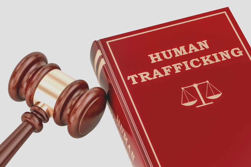 gavel next to large book titled "Human Trafficking"
