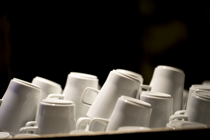 stacks of white mugs