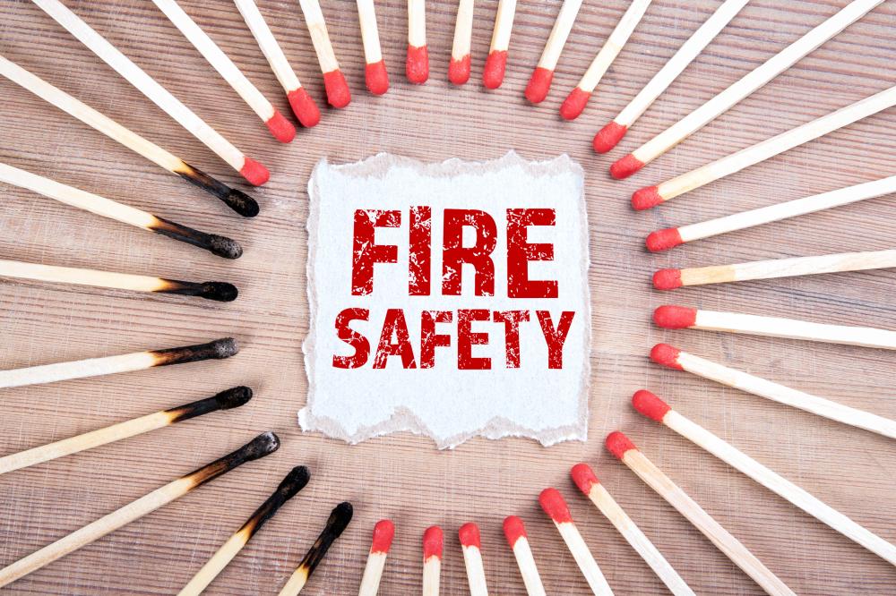 paper reading "fire safety" surrounded by unused and used matches