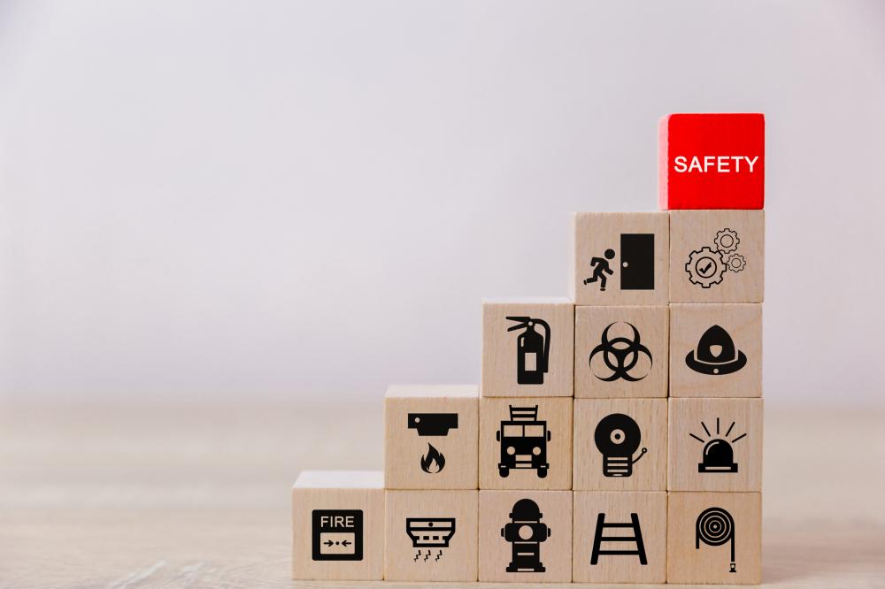 series of blocks with fire safety icons, organized into steps