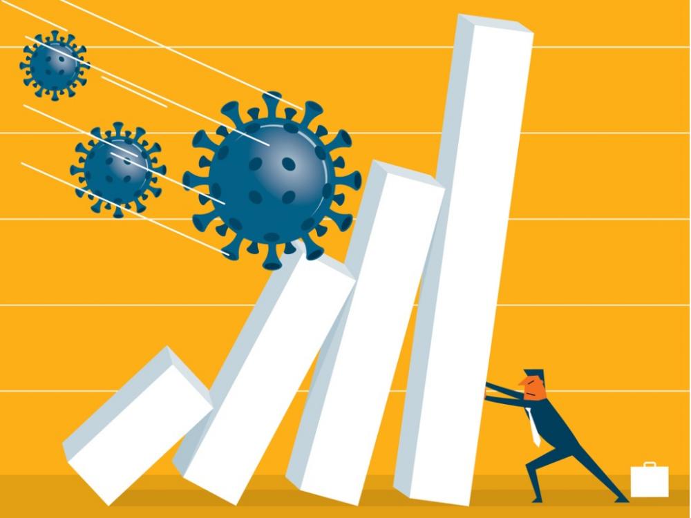 businessman holds up graph blocks against germs