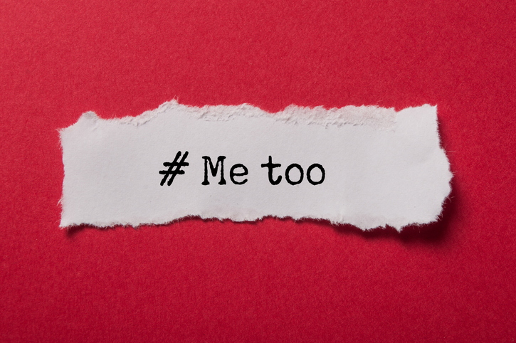 scrap of paper on red background, reading "#Metoo"