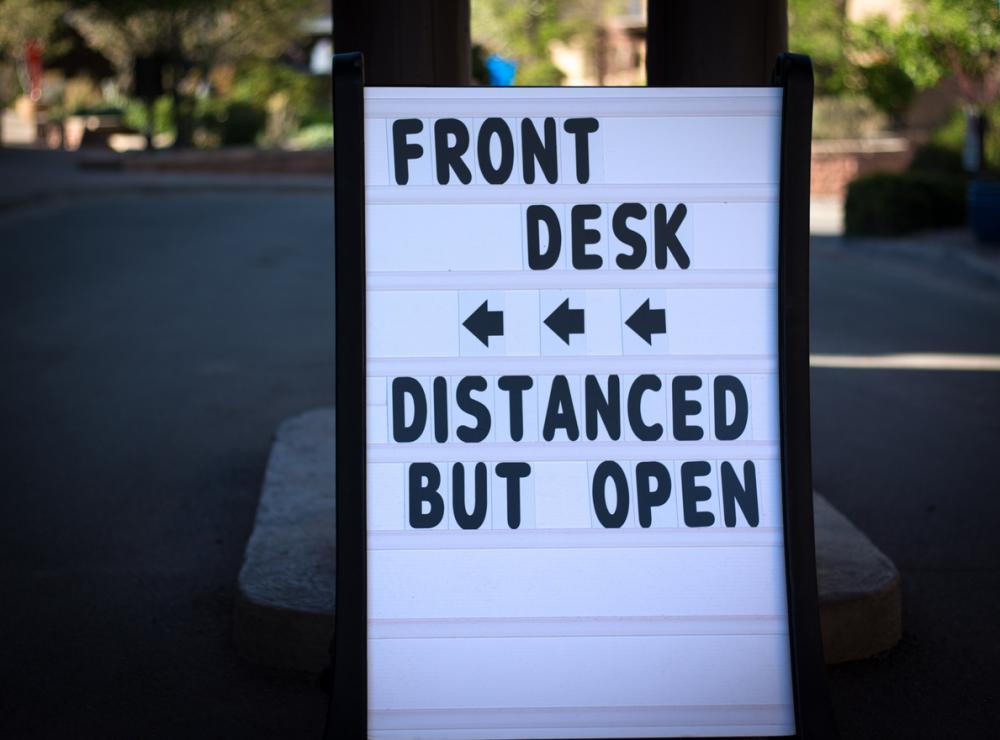 Reopening Sign: FRONT DESK, DISTANCED BUT OPEN