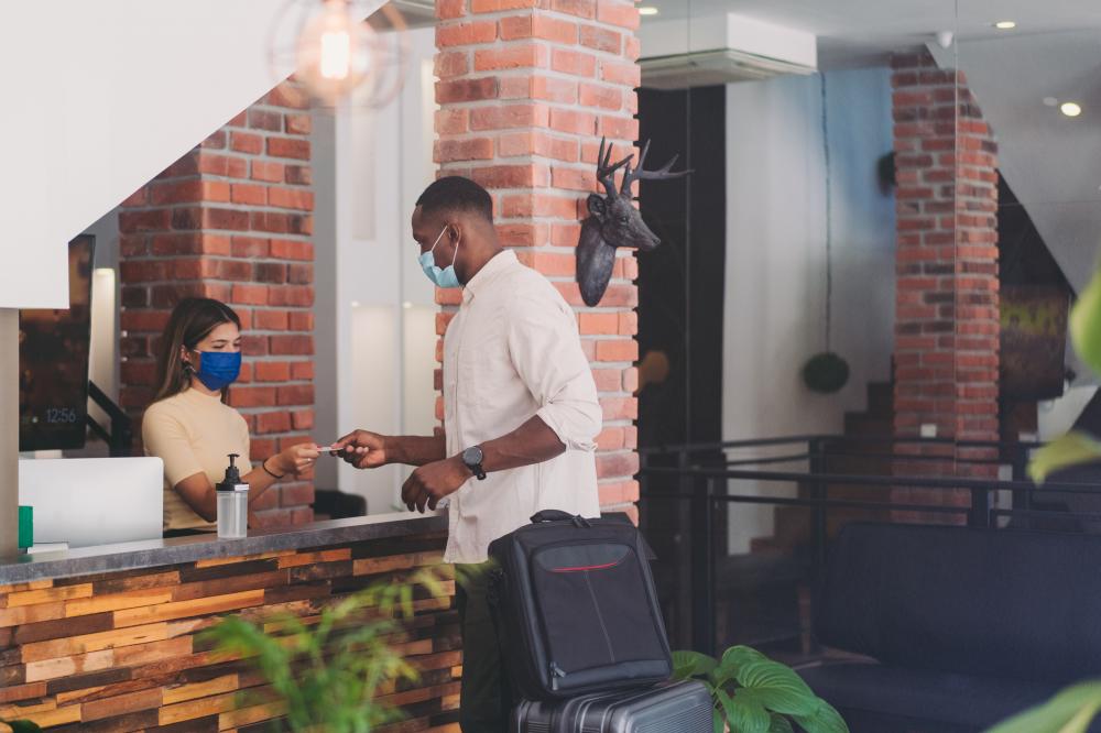 Businessman checking into hotel