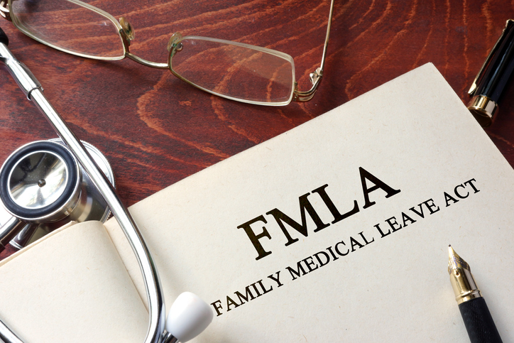 Page with FMLA family medical leave act on a table