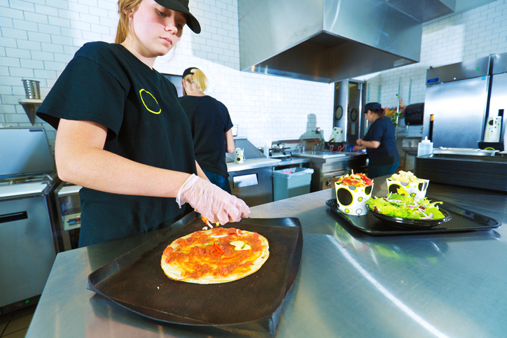 Young Kitchen Staff Worker Preparing Convenience Food